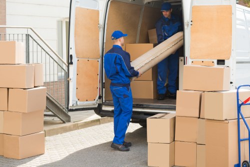 Furniture removal team planning a move in Swiss Cottage apartment building