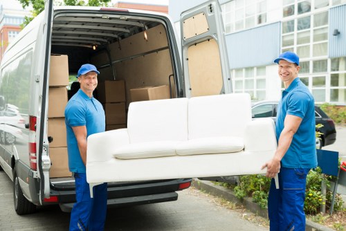 Moving team carrying boxes safely for a Swiss Cottage man and van service