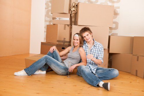 Organised moving boxes and wrapped household items prepared for flat removals in Swiss Cottage