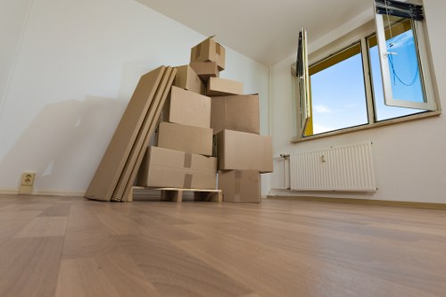 Local movers handling boxes and furniture in Swiss Cottage