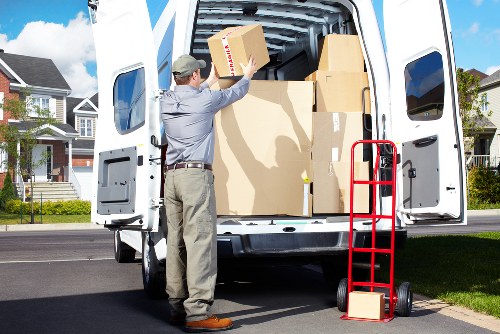 Professional movers handling household items in Swiss Cottage