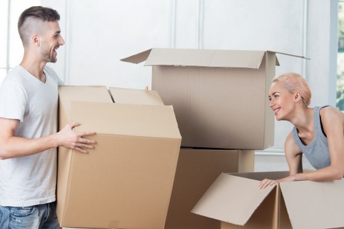 Removals team handling furniture and boxes in Swiss Cottage