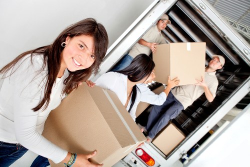 Loading furniture into a removal van near Swiss Cottage properties