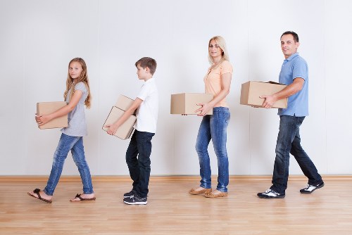 Careful loading of household furniture for removal in Swiss Cottage