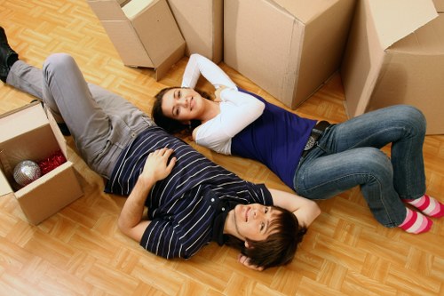 Unpacking boxes in a Swiss Cottage flat after relocation