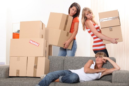 Team loading furniture into a removals vehicle for a same-day job